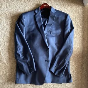 Calvin Klein navy blue men’s slim fit suit. Jacket 46R, pants 38W x 32L.